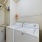 Washer and dryer with storage shelf