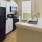 a kitchen with white cabinets