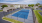Pickleball court with buildings in the background