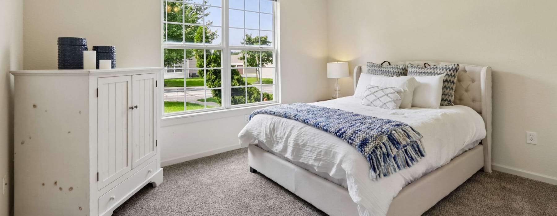 Apartment bedroom with large window