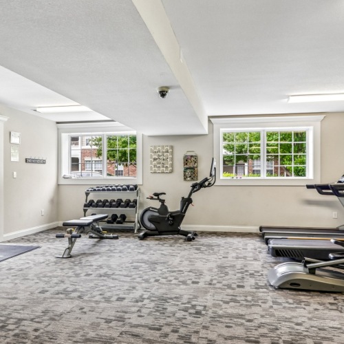 fitness center with elliptical, treadmill, and weight machines